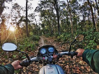 Man riding motorcycle in forest