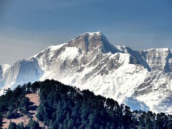 Scenic view of snowcapped mountains against clear sky