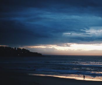 Scenic view of sea against dramatic sky