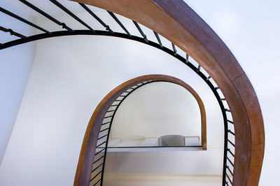 Low angle view of spiral stairs against sky