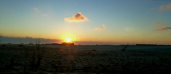 Panoramic view of beach against sky during sunset