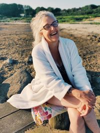 Woman at the beach in bathrobe 