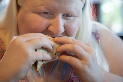 Close-up of woman eating food