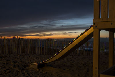 Scenic view of beach against sky during sunset