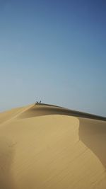 Scenic view of desert against clear sky