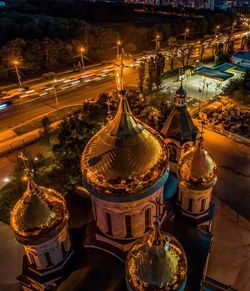 High angle view of illuminated buildings in city at night