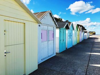 Beach huts against sky