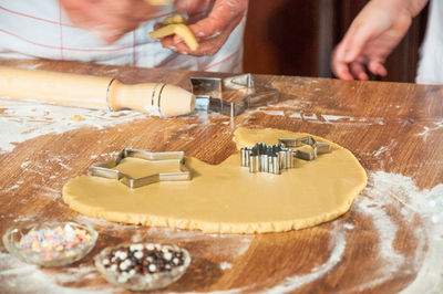 Midsection of woman preparing food at home