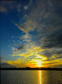 Scenic view of dramatic sky over sea during sunset