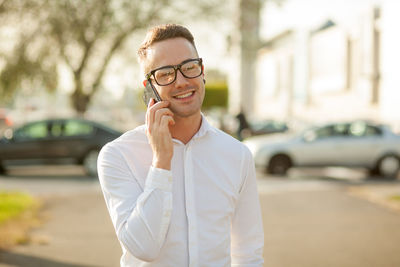 Portrait of man wearing mask in city