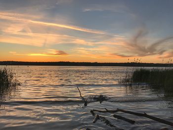Scenic view of lake against sky during sunset