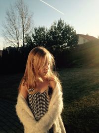 Portrait of beautiful woman against sky