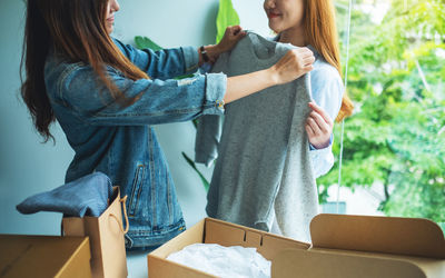 Midsection of woman holding gift