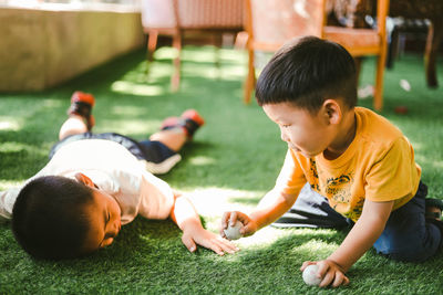Boy playing with dog