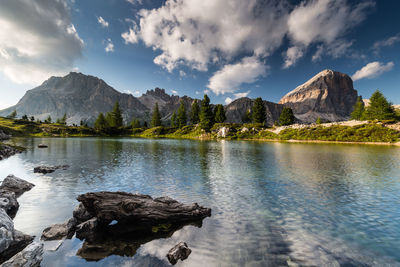 Scenic view of lake and mountains against sky