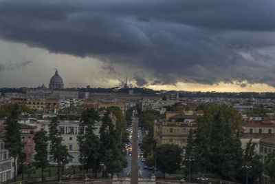 View of town against cloudy sky