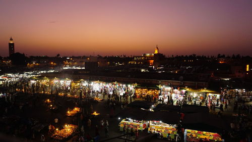 High angle view of illuminated buildings in city at night