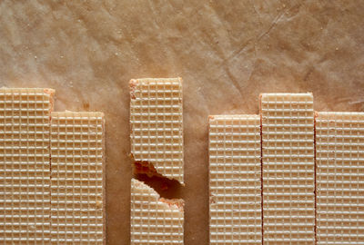 High angle view of people by swimming pool against building