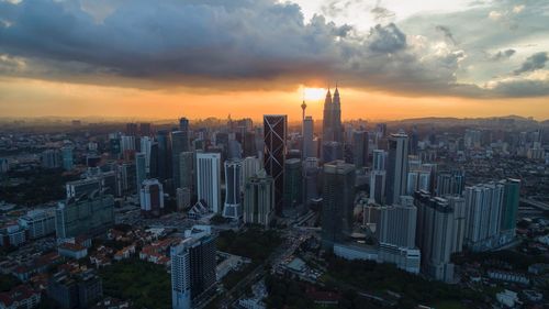 Aerial view of city during sunset