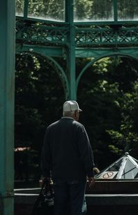 Rear view of man standing in gazebo