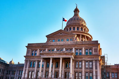 Low angle view of congress building against clear blue sky