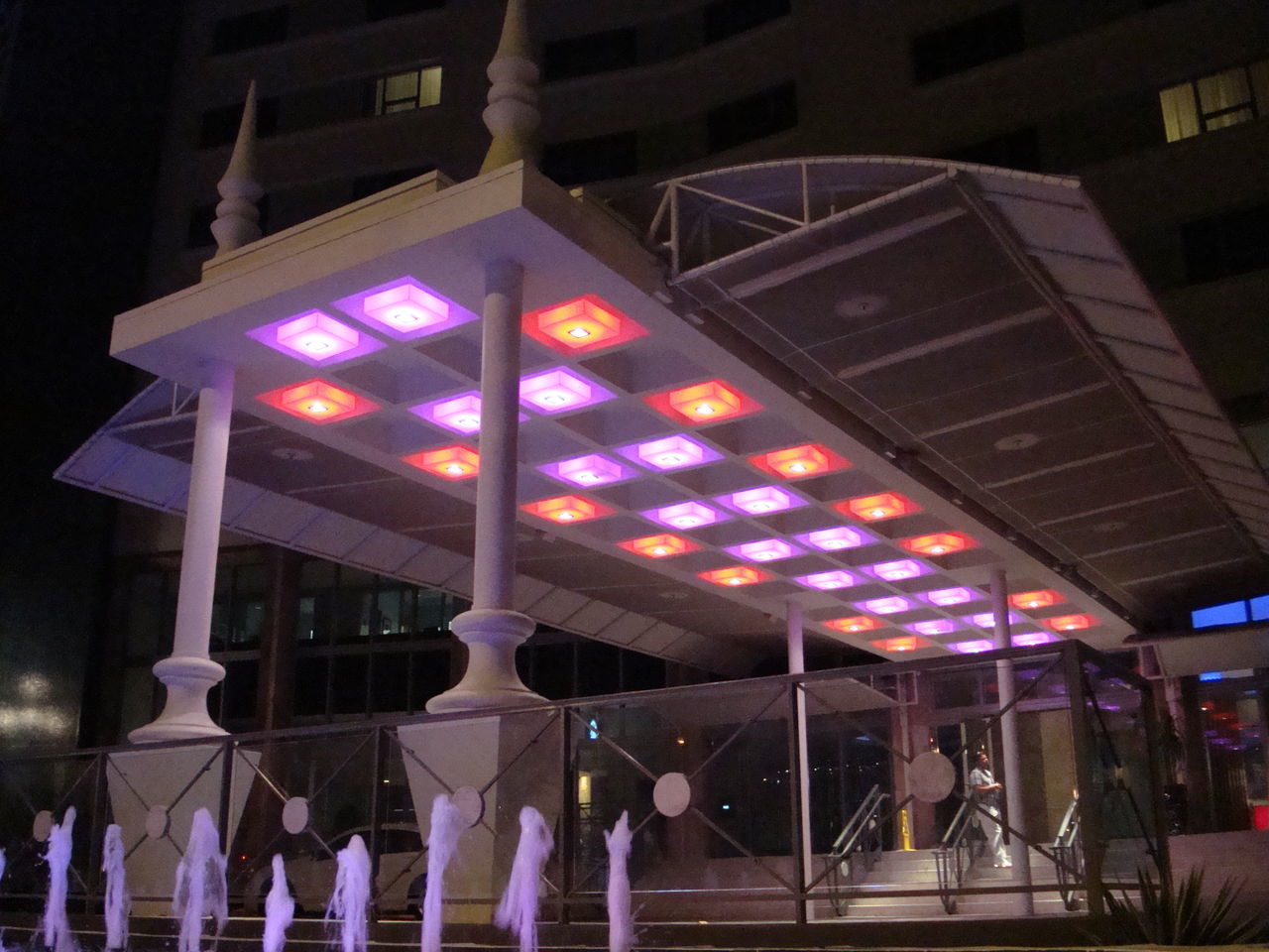 LOW ANGLE VIEW OF ILLUMINATED LIGHTS AT BUILDING