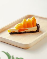 Close-up of orange slices in plate on table