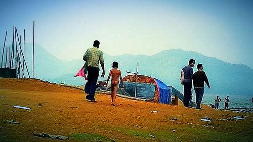 Man standing on mountain against clear sky