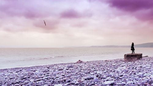 Scenic view of sea against cloudy sky