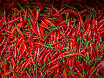 Full frame shot of red chili peppers for sale at market