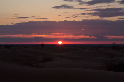 Scenic view of dramatic sky during sunset