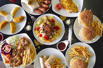 Top angle of various plates of different types of food