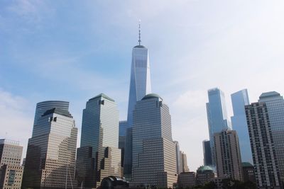 Low angle view of skyscrapers in city against sky