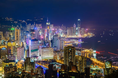 High angle view of illuminated buildings in city at night