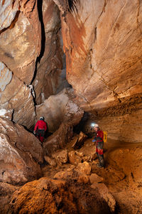 High angle view of people walking on rock