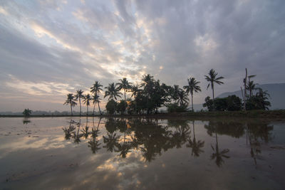 Scenic view of lake against sky during sunset