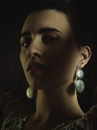 Close-up portrait of a young woman looking away