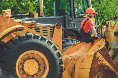 Rear view of man working at construction site