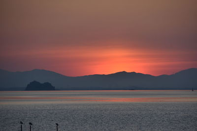 Scenic view of sea against sky during sunset