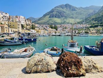 Boats moored at harbor