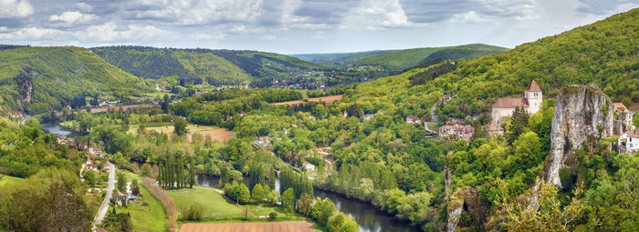 Panoramic view of green landscape against sky