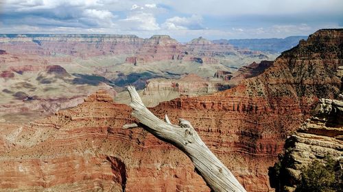 Scenic view of landscape against cloudy sky