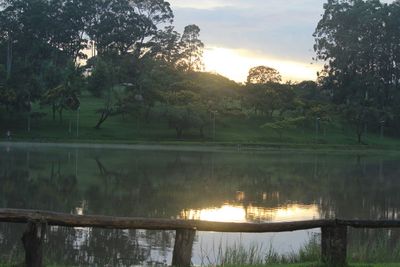 Scenic view of lake at sunset