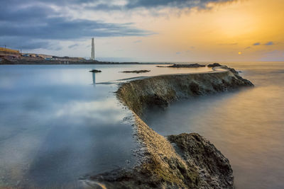 Scenic view of sea against sky during sunset