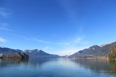 Scenic view of lake against blue sky