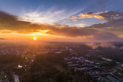 High angle view of buildings against sky at sunset