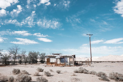 Built structure on beach against sky