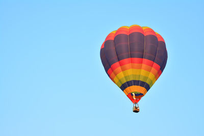 Low angle view of hot air balloon against blue sky