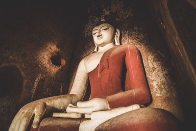 Low angle view of buddha statue