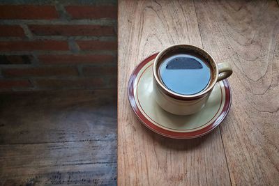 High angle view of coffee cup on table